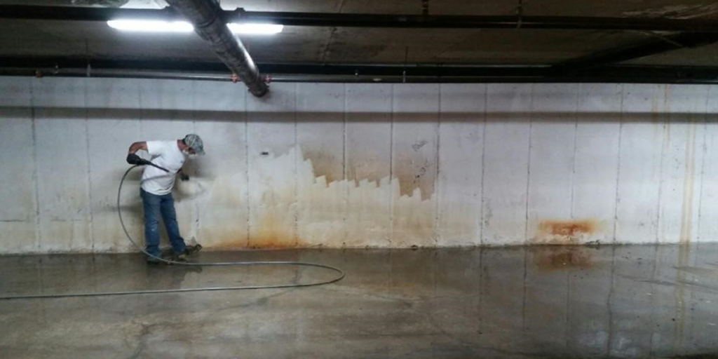 We clean parking garage and building walls removing stains